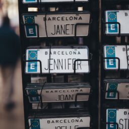Close-up of personalized name license plates for sale in Barcelona, Spain.