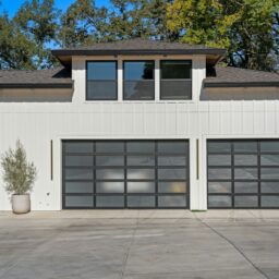 Modern garage doors on a white house